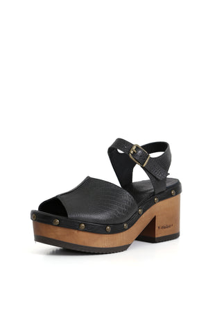 Kebba Clogs negros textura reptil vistos en perfil