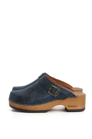 Zuecos de mujer para vestir azules con detalle de cascabel y base firme