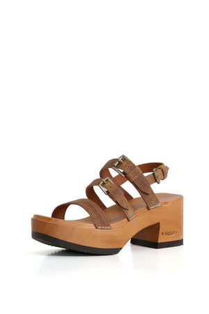 6.	Zuecos artesanales de cuero café con plataforma Pájaro y estilo Kebba.