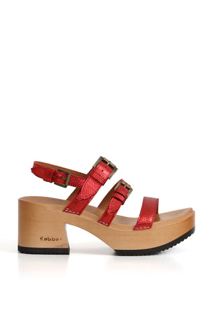	1.	Zuecos de mujer para vestir rojos con base de madera y hebillas metálicas Kebba Clogs.
