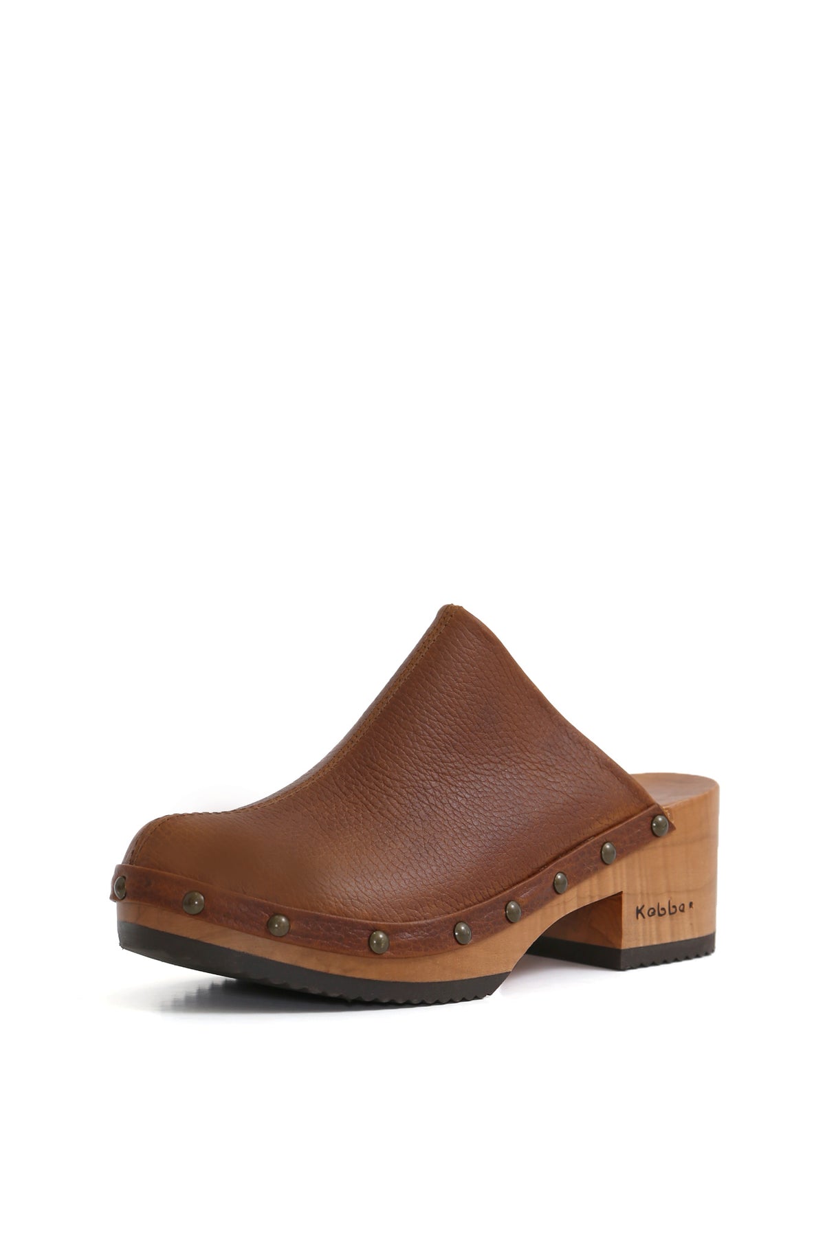 Kebba Clogs artesanales en cuero Texas tostado, vista lateral sobre fondo neutro